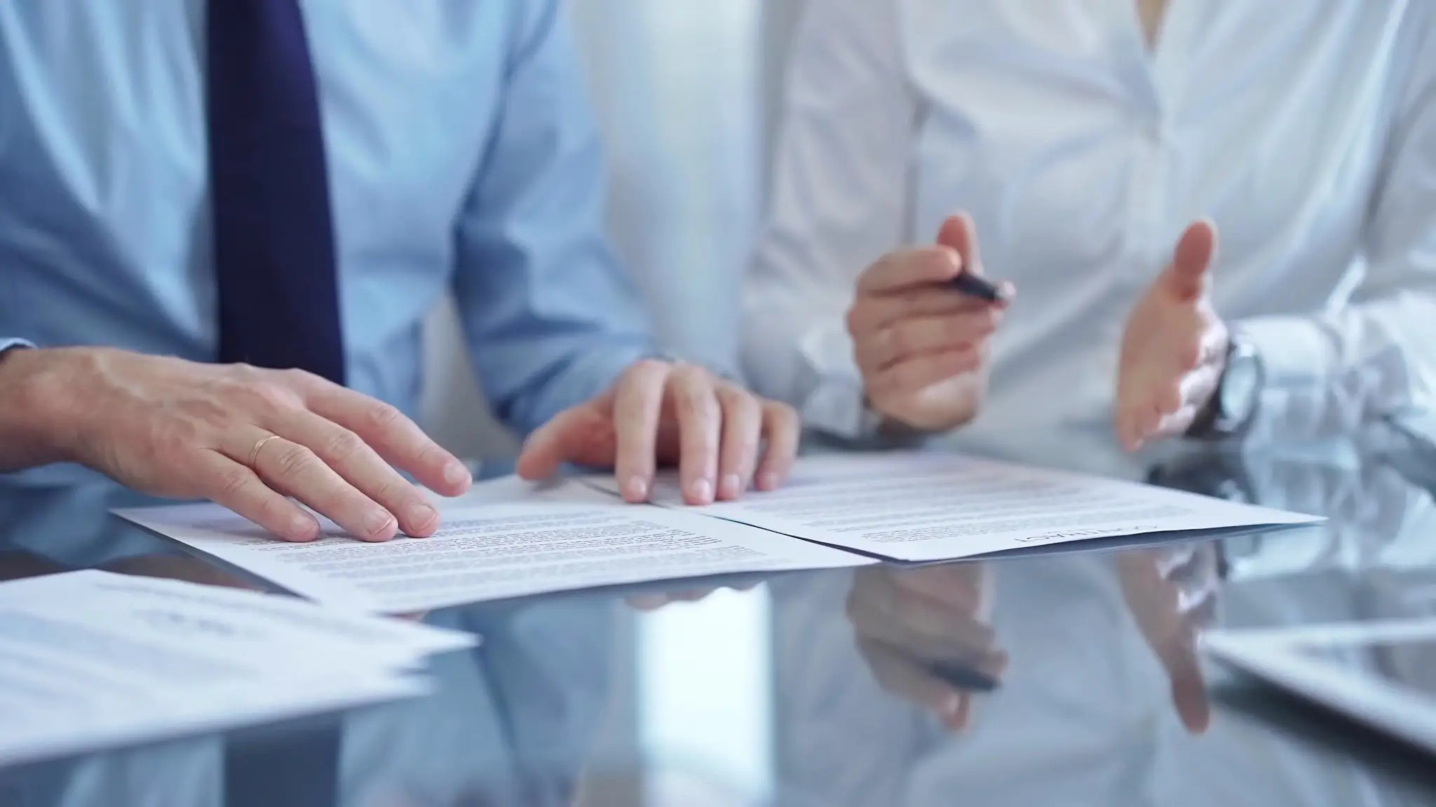 Bank and vendor stakeholders reviewing governance documents