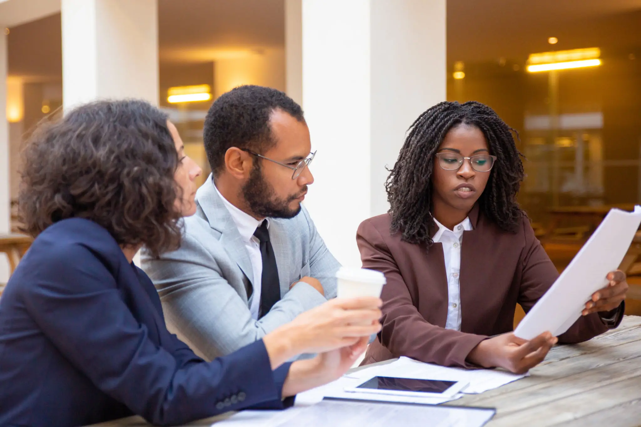 Community bank leadership reviewing AI underwriting dashboard and model documentation
